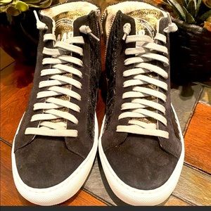 Brand new, never been worn, shiny black sneakers with grey laces, gold zipper.